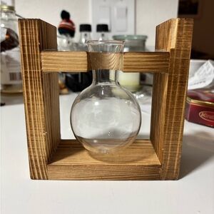 Handmade wooden stand and clear glass vase